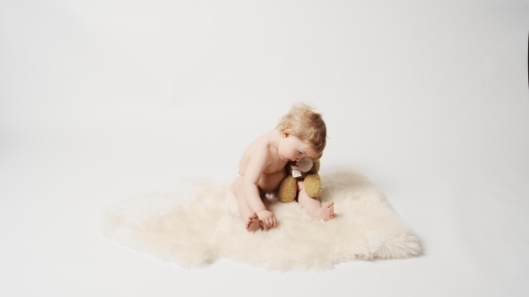 Baby Girl with Rabbit Toy