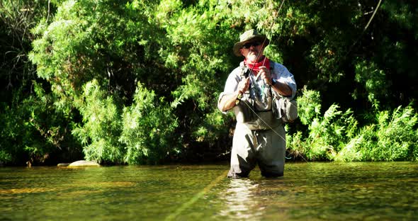 Man fly fishing in river