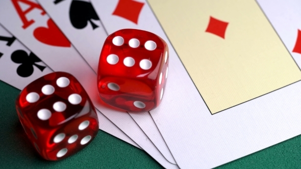 Red Dice on the Game Table with Cards and Chips To Play alt