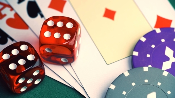 Red Dice on the Game Table with Cards and Chips To Play alt