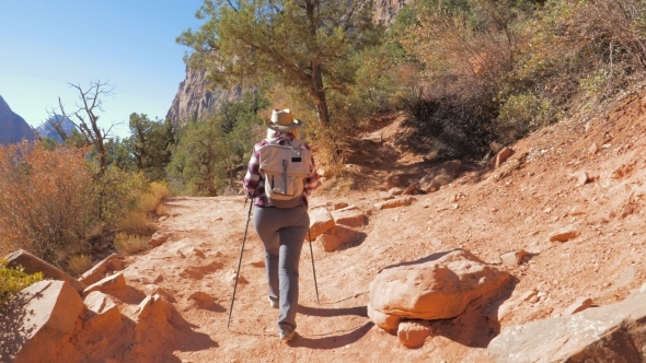 Hiking In Red Mountains Active Woman Walks Footpath In Zion Park
