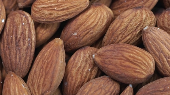 Almond . Rotating Nuts Background