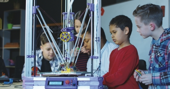 Teacher with Kids Exploring 3d Printing