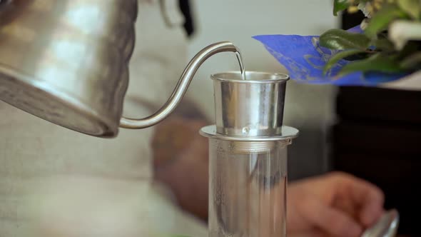 Barista Making Coffee in Coffeeshop