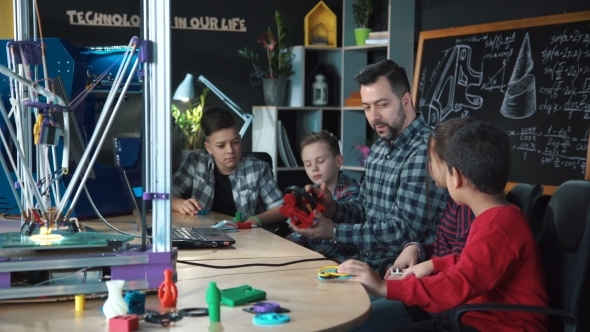 Teacher with Kids Exploring 3d Printing