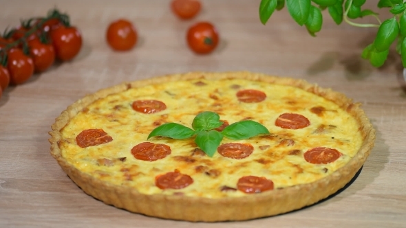 Cut with a Kitchen Knife a Piece of Quiche Lorraine