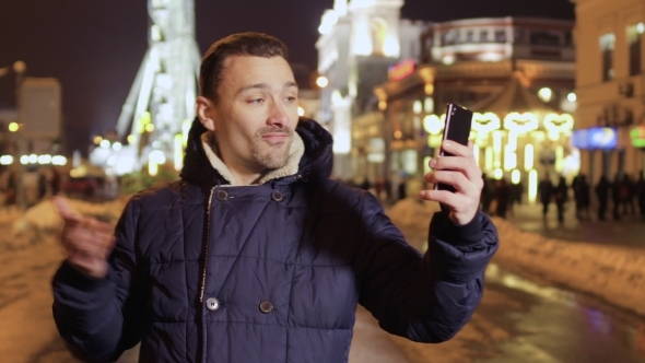 Young Man Shows City To the Friend and Talks with Him Through Video Call