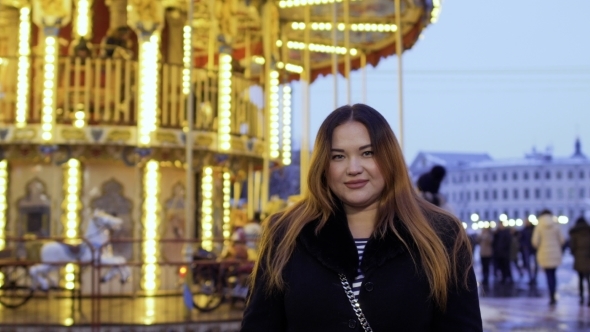 Beautiful Fat Woman Against Carousel Background