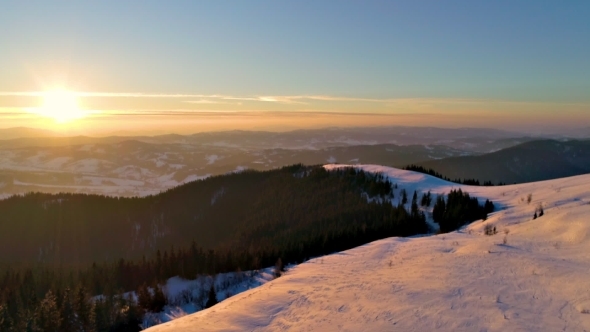 Flying Over Winterland, Mountain Snow Covered Winter Landscape.