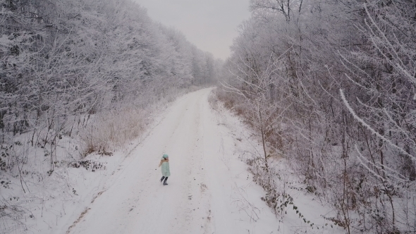 The Child Runs Along the Forest Road