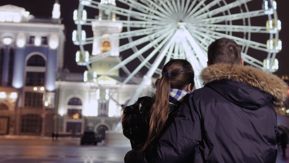 Young Couple Enjoys View on Beautiful Ferris Wheel