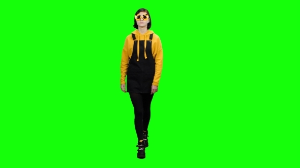 Teenager Goes in Funny Glasses and Fools Around Green Screen