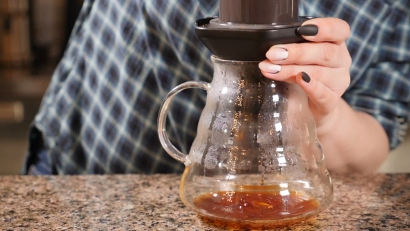 Modern and Alternative Ways of Coffee Making  Shoot of Barista Pushing Aeropress To the Brim Fo