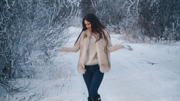 Girl Playing with Snow