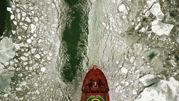 The Ship Sails Through the Sea Ice in the Winter