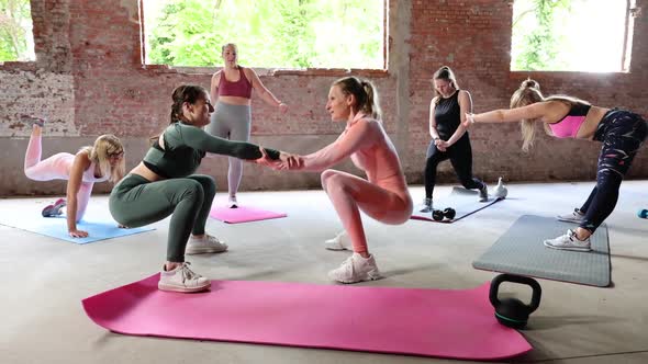 Group of Beautiful Fit Young Women Wearing Sports Clothing Together Doing Aerobics and Fitness