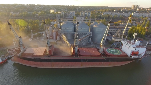 Aerial View of Big Grain Elevators on the Sea. Loading of Grain on a Ship