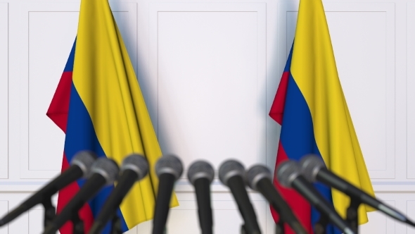Colombian Official Press Conference Featuring Flags of Colombia alt
