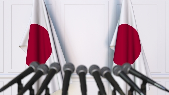 Japanese Official Press Conference Featuring Flags of Japan alt