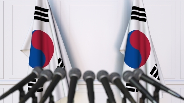 Korean Official Press Conference Featuring Flags of South Korea alt