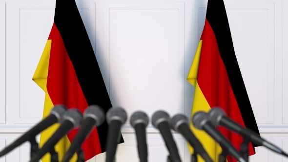 German Official Press Conference Featuring Flags of Germany alt