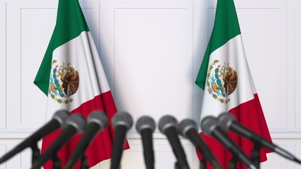 Mexican Official Press Conference Featuring Flags of Mexico alt