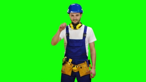 Builder Wears a Hard Hat and Smiles on Green Screen