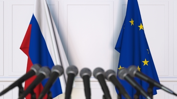 Flags of Russia and the European Union at International Press Conference alt
