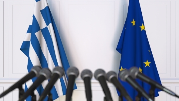 Flags of Greece and the European Union at International Press Conference alt