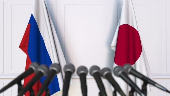 Flags of Russia and Japan at International Press Conference alt
