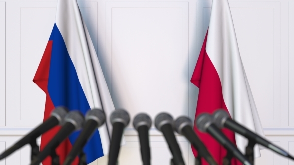 Flags of Russia and Poland at International Press Conference alt