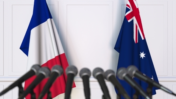 Flags of France and Australia at International Press Conference alt
