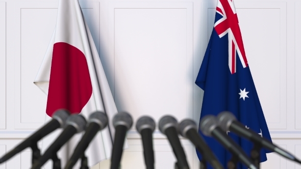 Flags of Japan and Australia at International Press Conference alt