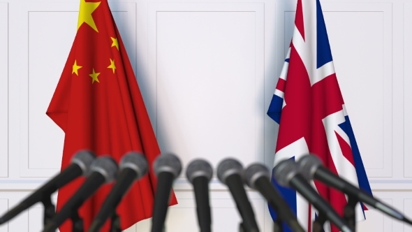 Flags of China and The United Kingdom at International Press Conference alt