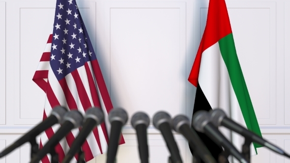 Flags of the USA and the UAE at International Press Conference alt