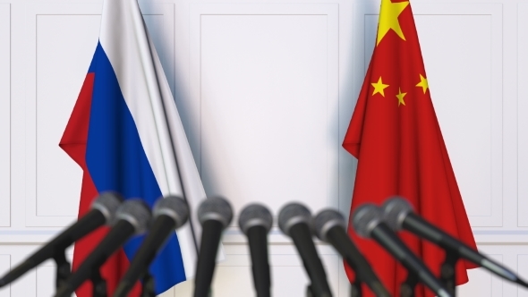 Flags of Russia and China at International Press Conference alt