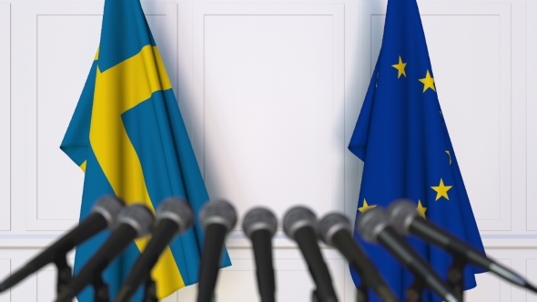 Flags of Sweden and the European Union at International Press Conference alt
