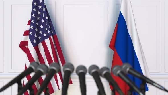 Flags of the USA and Russia at International Press Conference alt