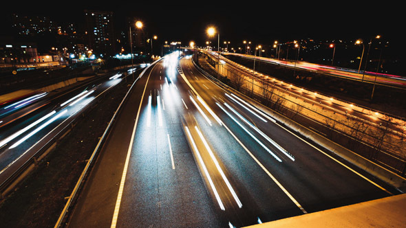 Highway Traffic Cars Driving at Multiple Lane Speedway