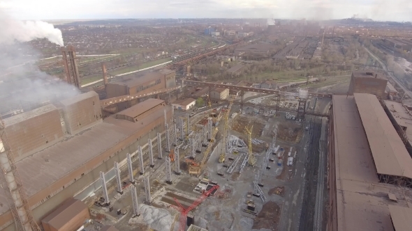 Aerial View of Industrial Steel Plant. Aerial Sleel Factory. Flying Over Smoke Steel Plant Pipes