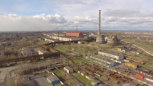 Aerial View of Industrial Steel Plant. Aerial Sleel Factory. Flying Over Smoke Steel Plant Pipes