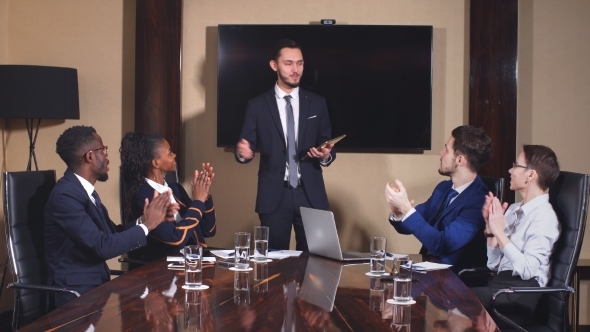 Boss Handshaking Employee Congratulating with Promotion While Diverse Colleagues Clapping Applauding