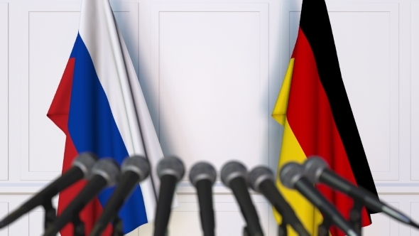 Flags of Russia and Germany at International Press Conference alt