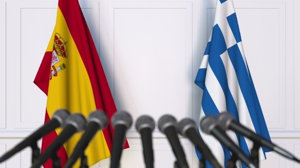 Flags of Spain and Greece at International Press Conference alt