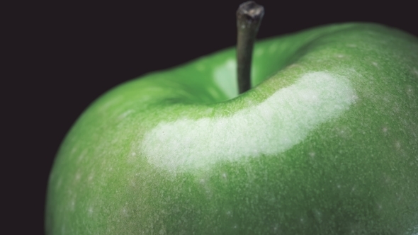Beautiful, Green Apple Spinning on Black Background,