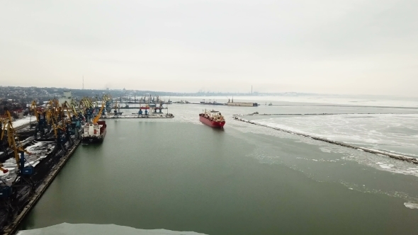 The Ship Sails Through the Sea Ice in the Winter