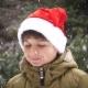 a Boy in a Red Christmas Hat Rejoices in Winter and Snow - VideoHive Item for Sale