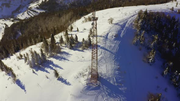 Flying Over Radio Communications Tower Mountain Snow Covered Winter Landscape