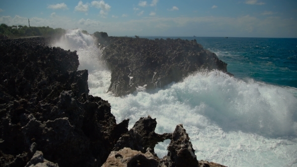 Powerful Waves Breaking Against the Rocky Shore