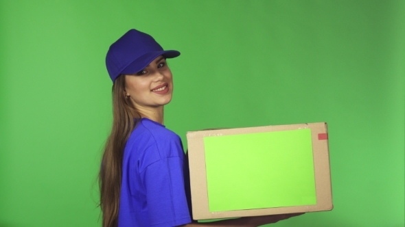 Gorgeous Delivery Service Female Agent Showing Thumbs Up Holding Cardboard Box